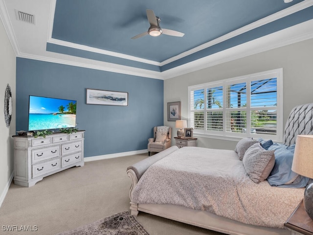 14748 Windward Ln, Naples, FL 34114 - bedroom with crown molding, a tray ceiling, visible vents, carpet floors, and baseboards