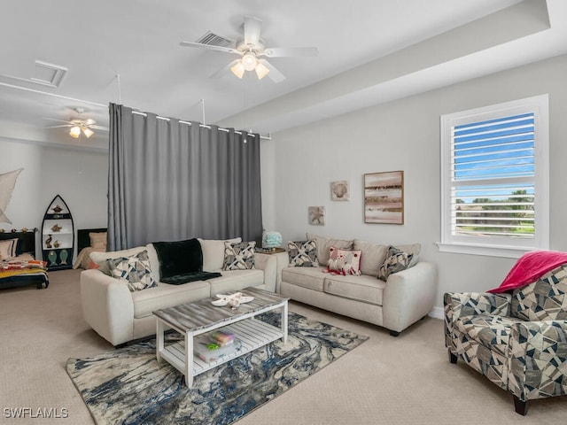 living room featuring ceiling fan and light colored carpet