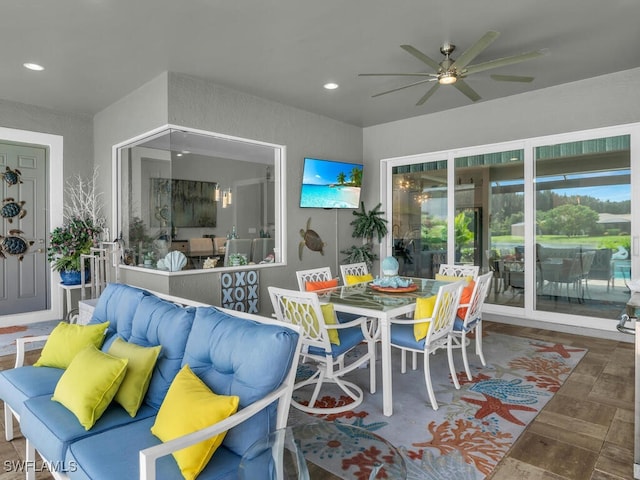 14748 Windward Ln, Naples, FL 34114 - exterior space featuring outdoor dining area, a ceiling fan, and an outdoor hangout area
