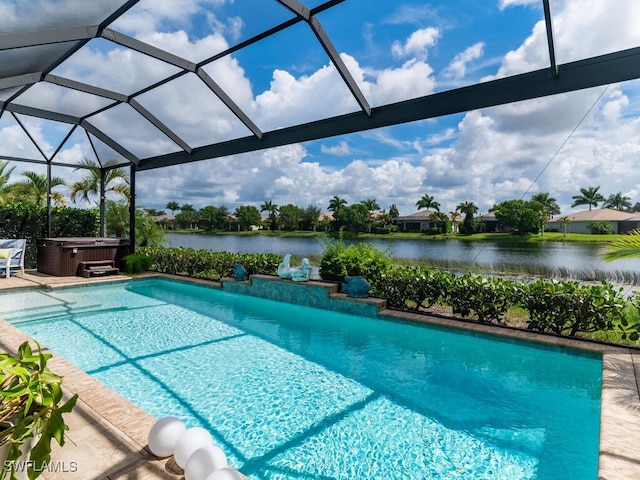 view of pool with a lanai, a water view, a hot tub, and a patio