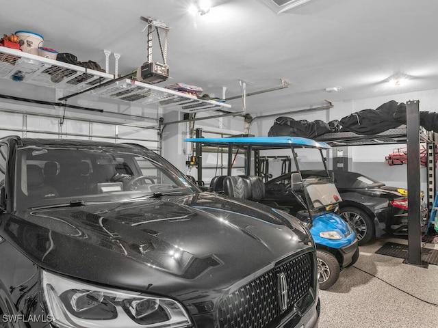14748 Windward Ln, Naples, FL 34114 - garage featuring a garage door opener