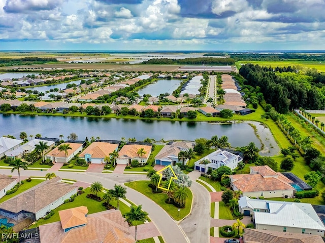 drone / aerial view with a water view