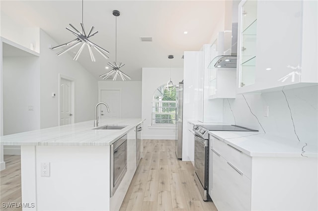 kitchen with a center island with sink, stainless steel appliances, sink, and white cabinetry