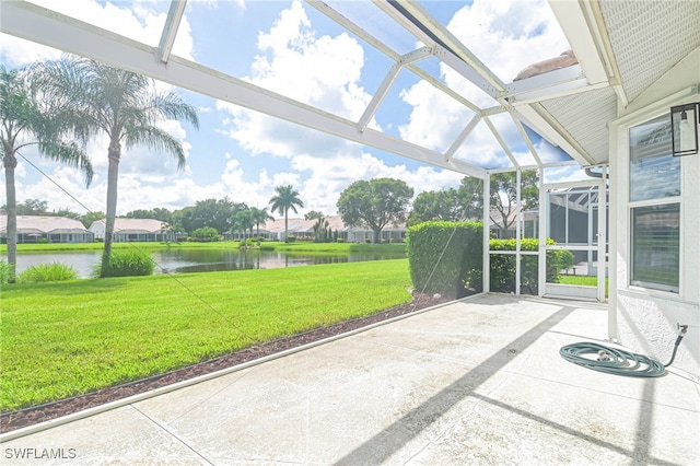 unfurnished sunroom with a water view