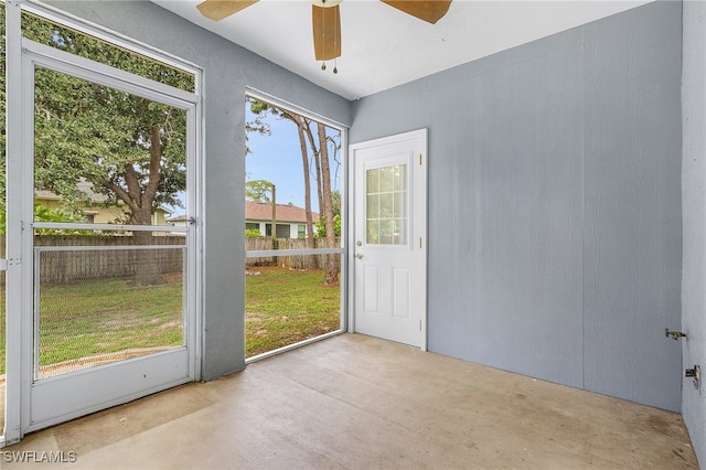 doorway with ceiling fan