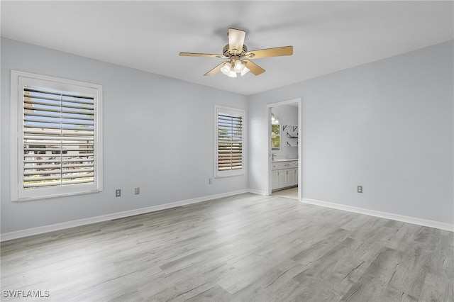 unfurnished room featuring ceiling fan and light hardwood / wood-style floors