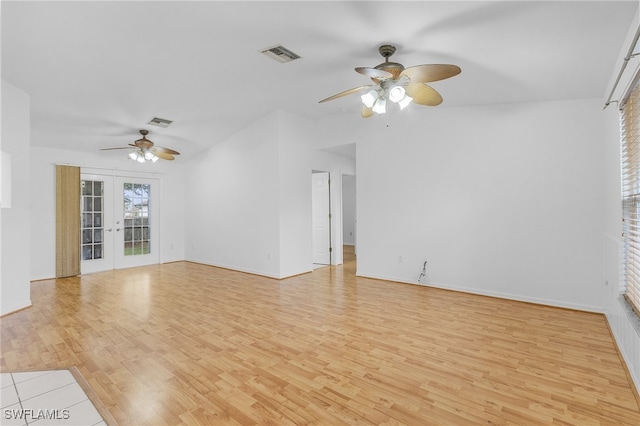 spare room featuring french doors, light hardwood / wood-style flooring, and ceiling fan