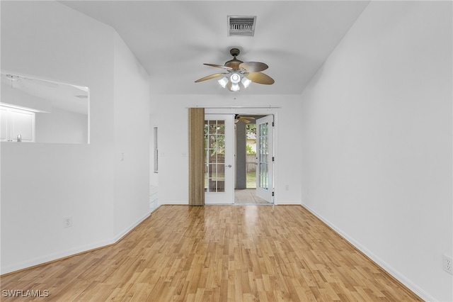 unfurnished room featuring light hardwood / wood-style flooring and ceiling fan