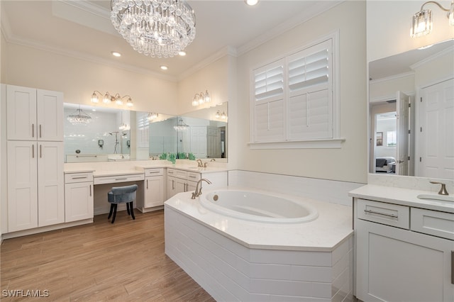 bathroom featuring hardwood / wood-style floors, vanity, ornamental molding, independent shower and bath, and a notable chandelier