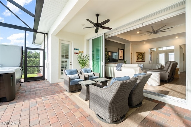 sunroom / solarium with ceiling fan and french doors