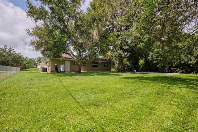 view of yard with central AC unit