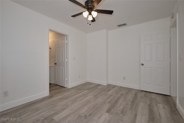 unfurnished bedroom with ceiling fan and light wood-type flooring