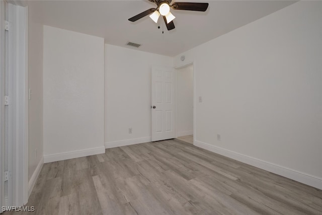 unfurnished room with light hardwood / wood-style flooring and ceiling fan