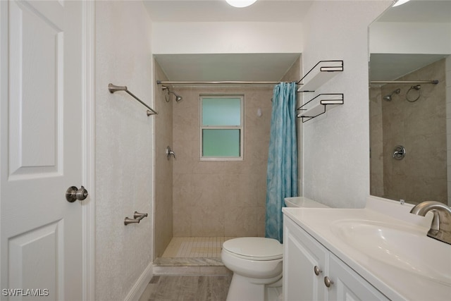 bathroom with vanity, toilet, and a shower with curtain