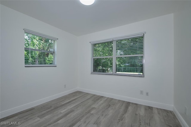 unfurnished room featuring light hardwood / wood-style flooring