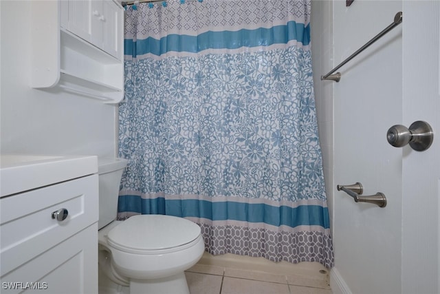 bathroom featuring walk in shower, tile patterned flooring, vanity, and toilet