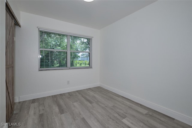 empty room with light wood-type flooring