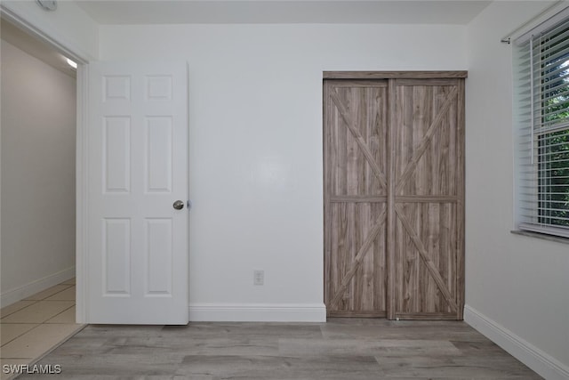 unfurnished bedroom with light hardwood / wood-style floors