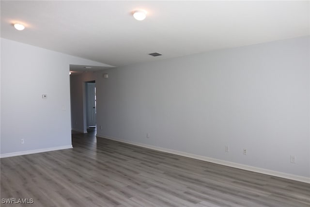 empty room featuring wood-type flooring