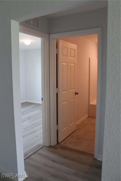 hallway featuring light hardwood / wood-style floors