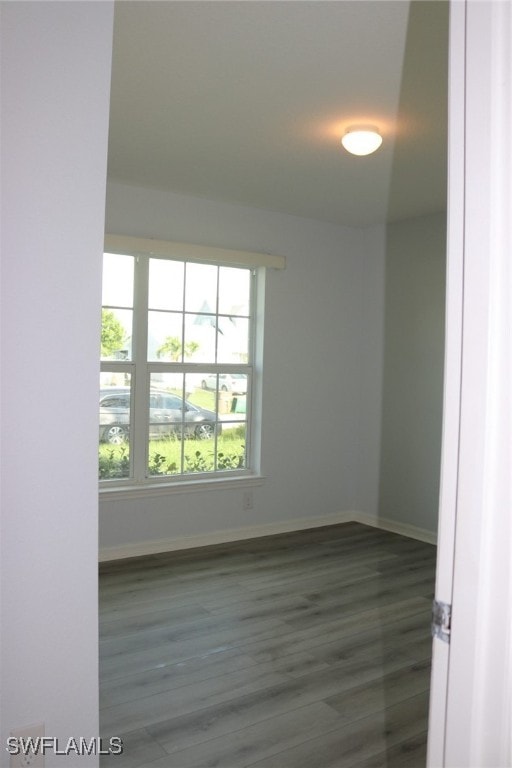 spare room featuring dark hardwood / wood-style flooring