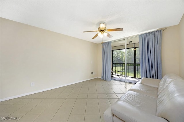 unfurnished living room featuring light tile patterned floors, a textured ceiling, and ceiling fan