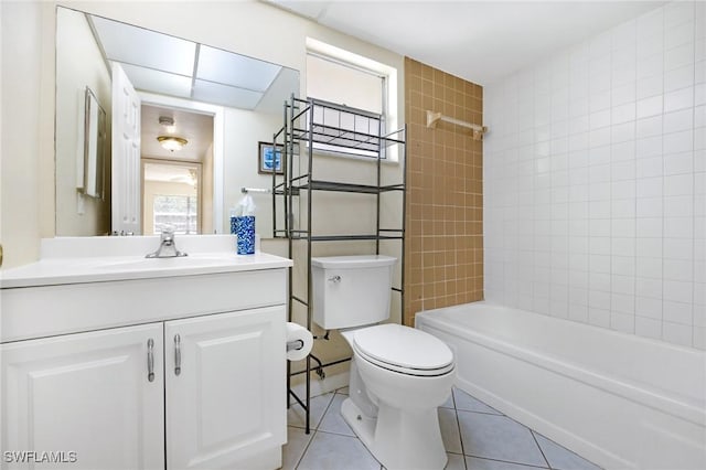 full bathroom with toilet, vanity, tile patterned floors, and a healthy amount of sunlight