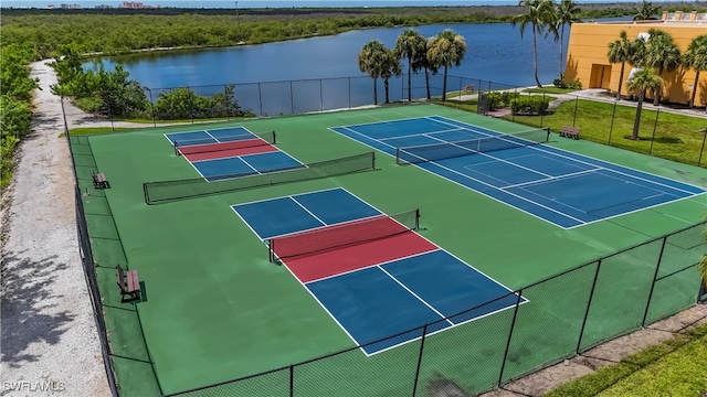 view of tennis court featuring a water view and basketball court