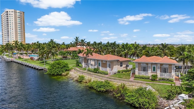 birds eye view of property with a water view