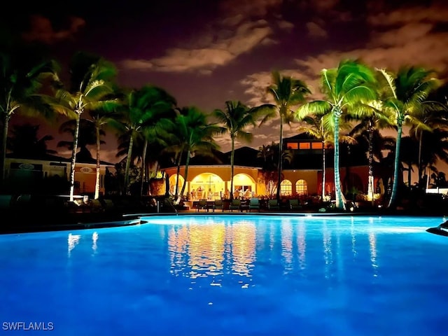 view of pool at night