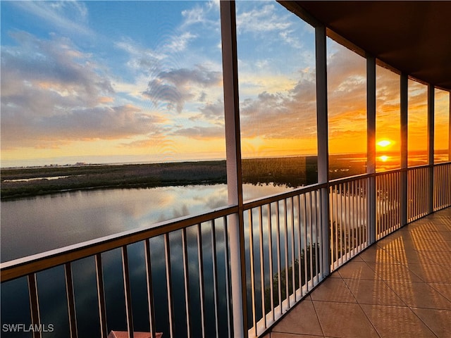 balcony at dusk with a water view