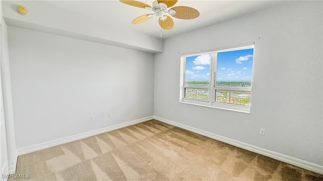 empty room featuring ceiling fan and carpet flooring