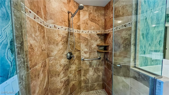 bathroom with tiled shower