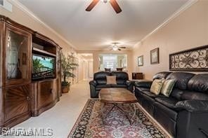 living room featuring ceiling fan and ornamental molding