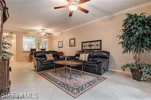 living room with ceiling fan and ornamental molding