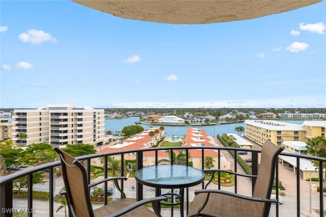 balcony featuring a water view