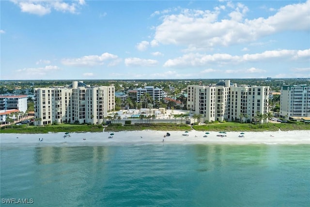 bird's eye view featuring a water view and a view of the beach