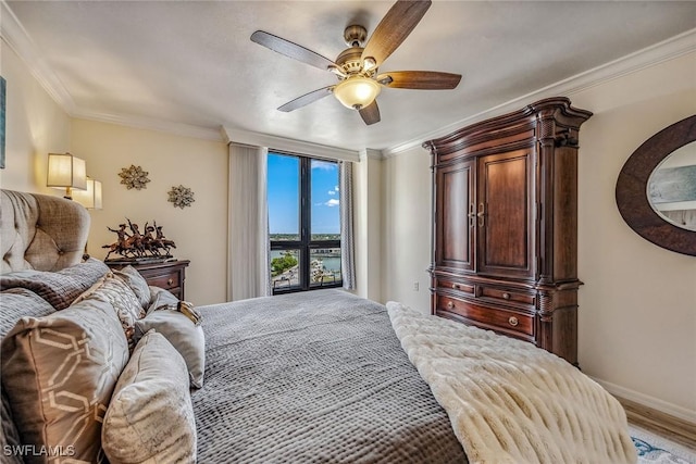 bedroom featuring crown molding, wood-type flooring, and ceiling fan