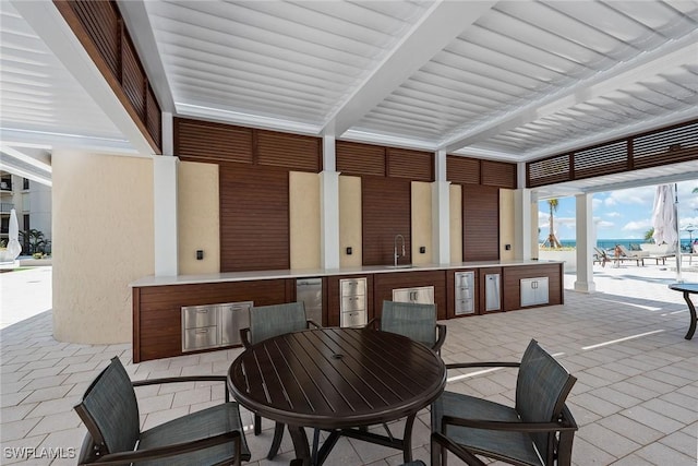 view of patio / terrace featuring sink and exterior kitchen