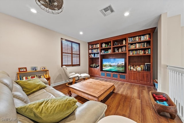 living room with hardwood / wood-style flooring and radiator heating unit