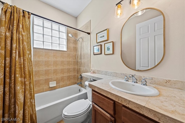 full bathroom with vanity, toilet, and shower / tub combo