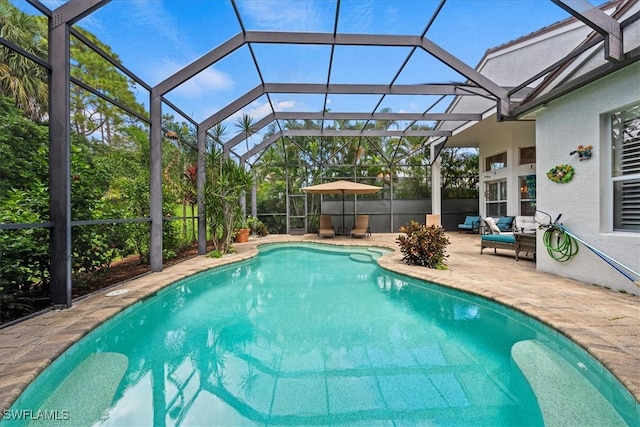 view of pool with an outdoor living space, a patio, and a lanai