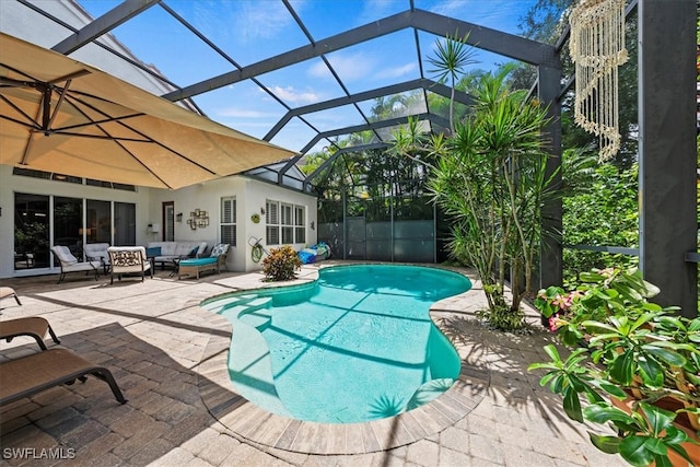 view of swimming pool with glass enclosure, an outdoor hangout area, and a patio