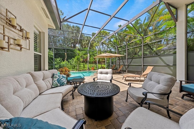 view of patio / terrace with a lanai, a fenced in pool, and an outdoor hangout area