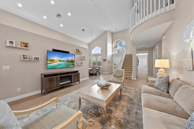 tiled living room featuring high vaulted ceiling