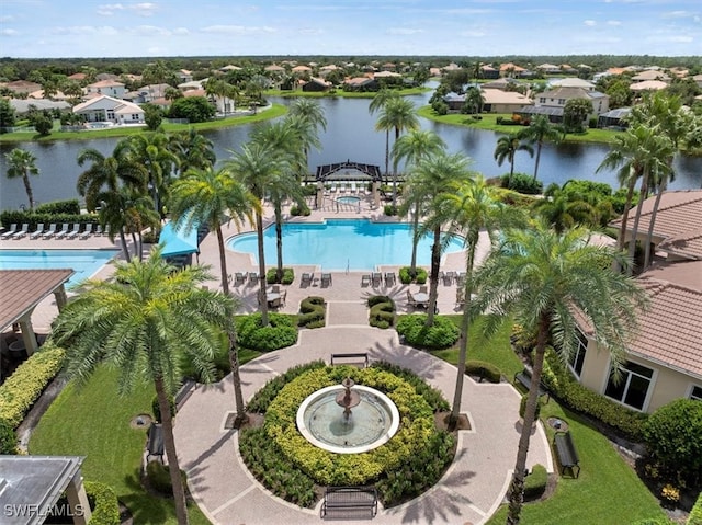 view of swimming pool with a water view