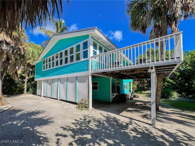 view of front of home featuring a wooden deck