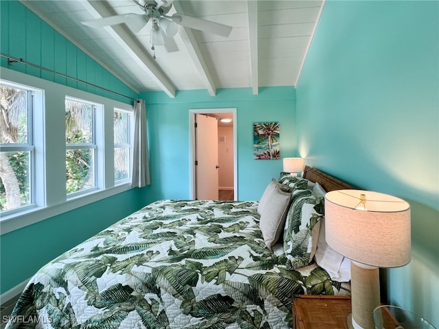 bedroom with ceiling fan and lofted ceiling with beams