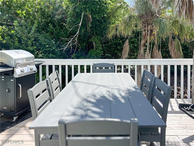 4570 Escondido Ln, Upper Captiva, FL 33924 - wooden terrace with outdoor dining area and a grill
