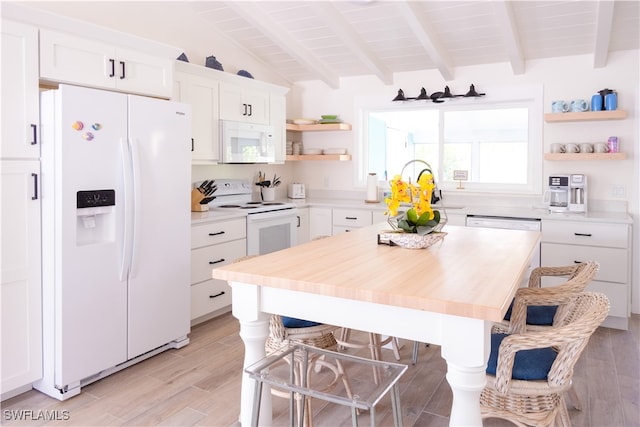 kitchen with light hardwood / wood-style floors, white cabinetry, and white appliances